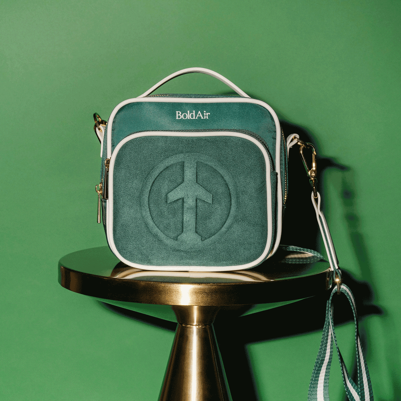 BoldAir Boarding Bag in vietnam green. Women's travel crossbody, or personal item bag, with white piping and gold tone hardware.