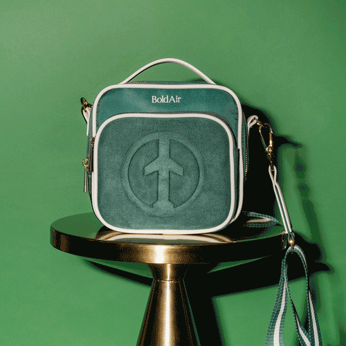 BoldAir Boarding Bag in vietnam green. Women's travel crossbody, or personal item bag, with white piping and gold tone hardware.