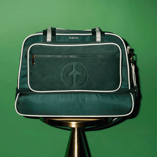 360 degree view of the green BoldAir Stayover Bag, a women's weekender bag with white piping, gold hardware, a dedicated shoe compartment, laptop sleeve, and luggage sleeve.